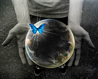 Planet Earth, blue butterfly, hands