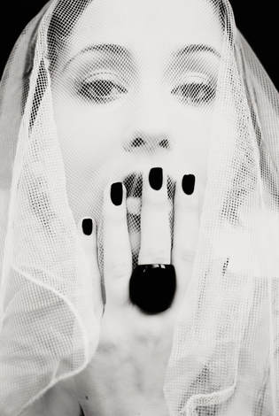 Woman in veil black nails